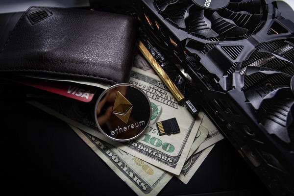 Leather wallet with crypto coins and banknotes