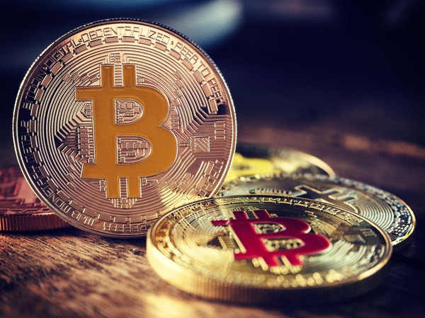 Close-up of gold and silver Bitcoin coins