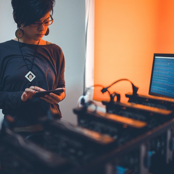 Person working at a computer in a warmly lit room
