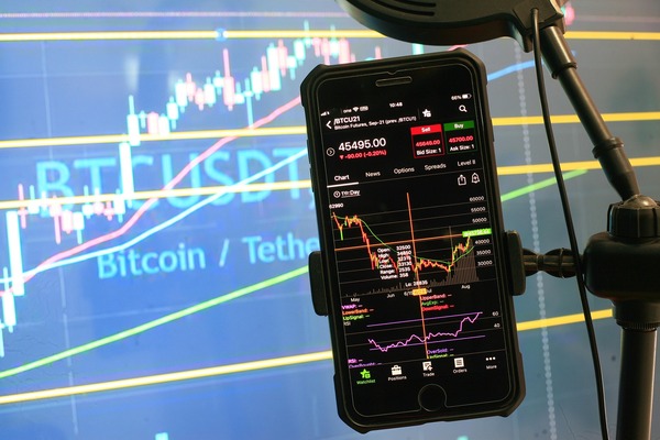 Smartphone showing a Bitcoin to Tether trading chart